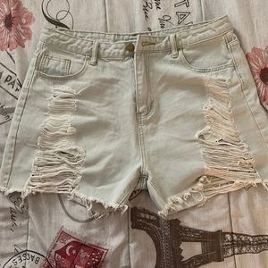 Light blue jeans with rips front and back